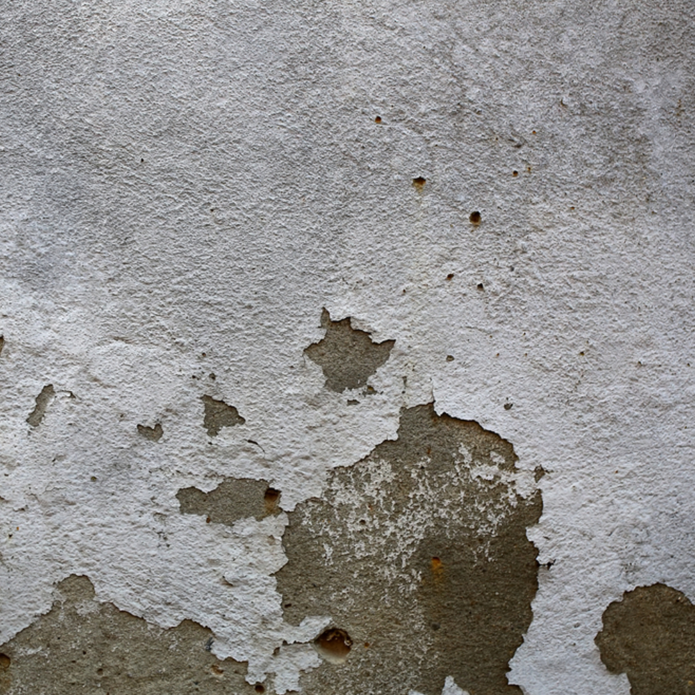 Close-up of peeling epoxy floor coating showing cracks and wear in Hawaii.